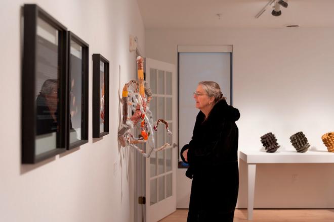 people viewing the artwork on display